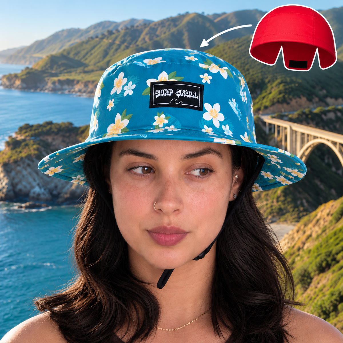 A woman wearing a blue floral bucket hat with a black brand patch, set against a scenic coastal background. A red helmet graphic in the top right shows the hat's underside with a black hook-and-loop closure.